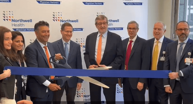 Michael Dowling (middle, with orange tie), the CEO of Northwell Health System is pictured here with Northwell officials at last week’s ribbon cutting ceremony that unveiled Concorde Cardiology at Park Avenue South in Manhattan.