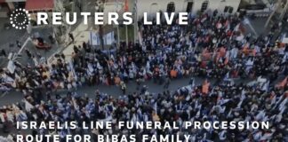 Israelis line funeral procession route for Bibas family