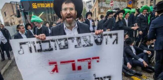 Ultra-Orthodox Jews protest against proposals for joining the IDF. Photo by Oren Ben Hakoon