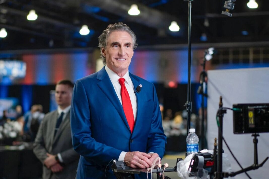 North Dakota Gov. Doug Burgum prepares for a TV interview at the media filing center and spin room at the Pennsylvania Convention Center ahead of the presidential debate between Republican nominee former President Donald J. Trump and Democratic nominee Vice President Kamala Harris in Philadelphia, Pa., on Sept. 10, 2024. Madalina Vasiliu/The Epoch Times