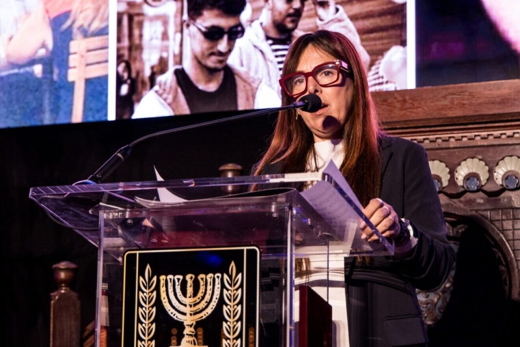 Ayelet Samerano, whose 21-year-old son, Yonatan Samerano, was shot by Hamas terrorists and abducted by a UNRWA social worker on Oct. 7, 2023, speaks at a memorial, sponsored by the Israeli Consulate General in New York and the Israeli-American Council, at Park East Synagogue on Manhattan's Upper East Side on Oct. 28, 2024. Credit: Ohad Kab studio/Israeli Consulate General