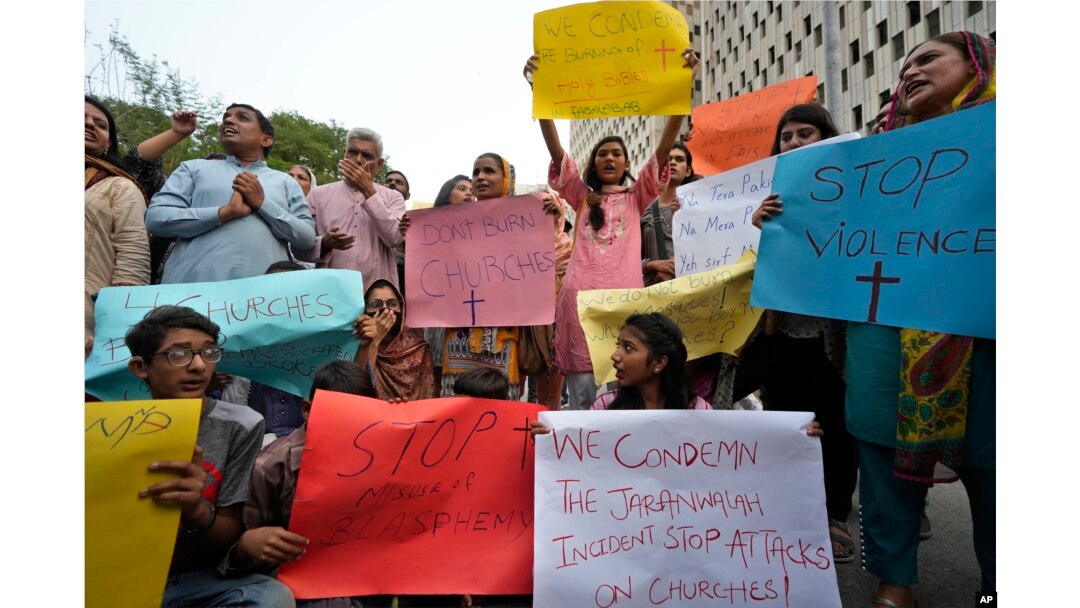 Members of Christian groups and others demonstrate to condemn the attack on a Christian area and a burned church by angry Muslim mob in Karachi, Pakistan, Aug. 16, 2023.