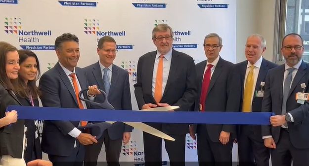 Michael Dowling (middle, with orange tie), the CEO of Northwell Health System is pictured here with Northwell officials at last week’s ribbon cutting ceremony that unveiled Concorde Cardiology at Park Avenue South in Manhattan.||