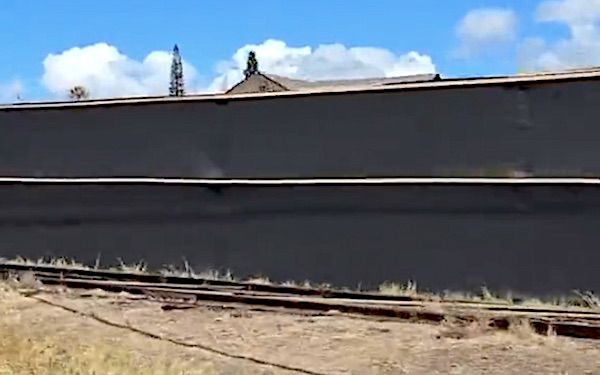 Black fencing erected in Lahaina, Maui, in August 2023 to block the public's view of ground zero of the Hawaiian fires (Video screenshot)