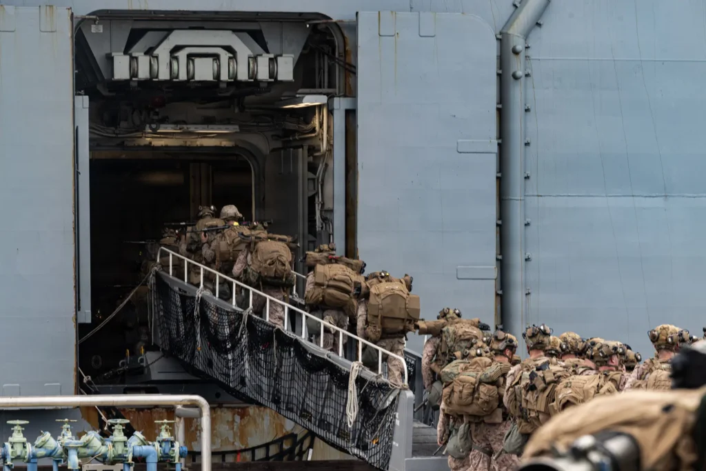  U.S. Marines with Lima Company, Battalion Landing Team 3rd Battalion, 1st Marine Regiment, 31st Marine Expeditionary Unit, conduct a hike during a simulated amphibious assault in the 7th Fleet area of operations in the Indo-Pacific region on March 24, 2026  Cpl. Nicole Stuart/U.S. Marine Corps via DVIDS