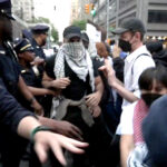 ‘New York Times’ defends its reporting on Israel after freelancer holds up note to protesters, ‘Have you read Kristof?’
